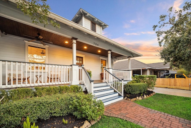 view of front of house featuring ceiling fan and covered porch