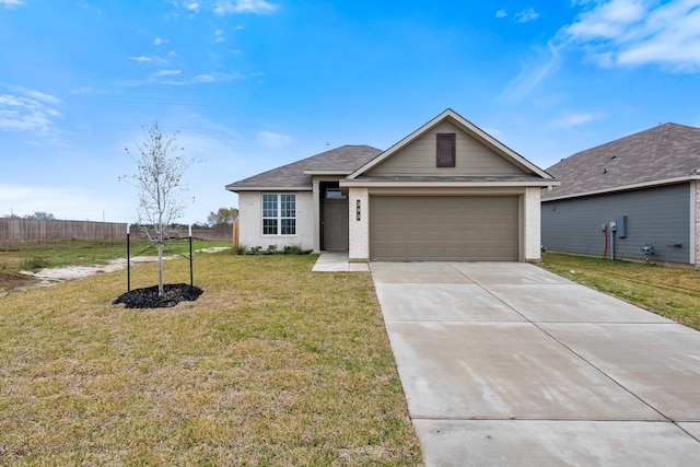 ranch-style home with a garage and a front yard