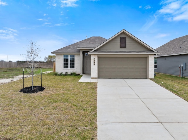 view of front of house with a front yard and a garage