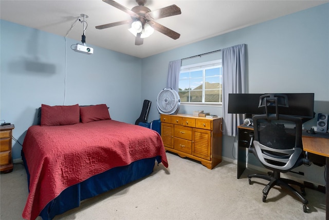 bedroom with ceiling fan and light colored carpet