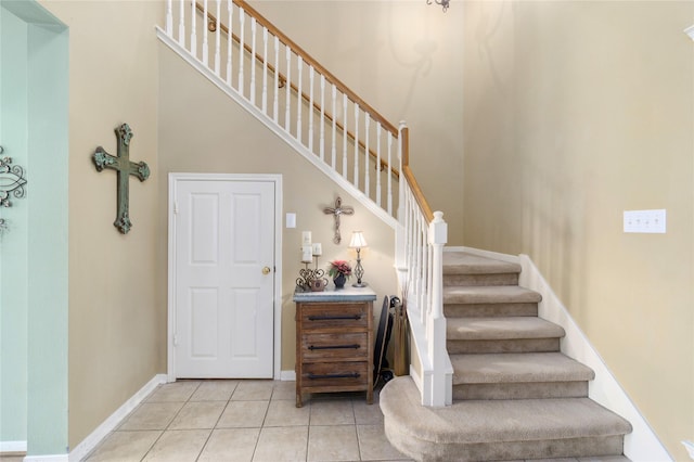 stairs featuring tile patterned floors