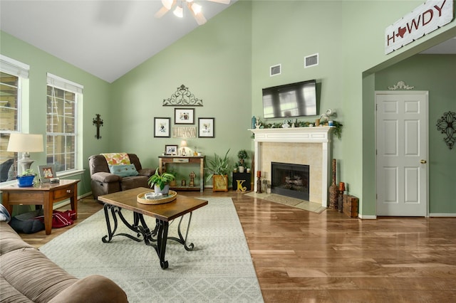 living room featuring hardwood / wood-style floors and high vaulted ceiling