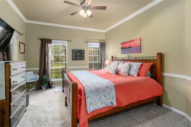 carpeted bedroom featuring ceiling fan and crown molding