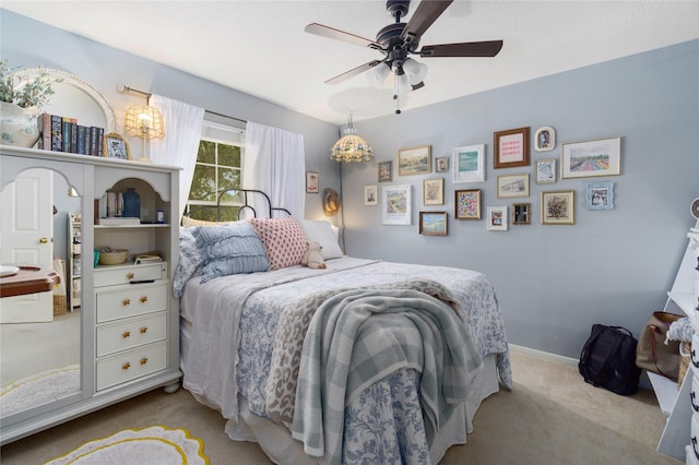 bedroom featuring ceiling fan and light colored carpet