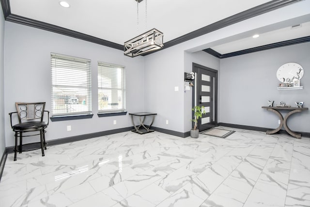 foyer entrance featuring a notable chandelier and ornamental molding