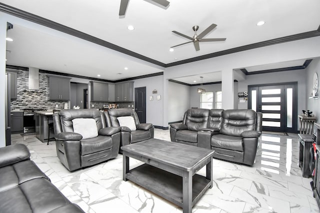 living room featuring ceiling fan and ornamental molding