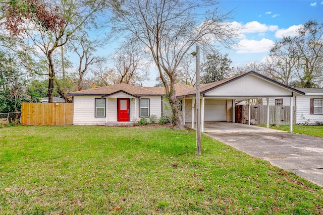 ranch-style house with a front lawn, a garage, and a carport