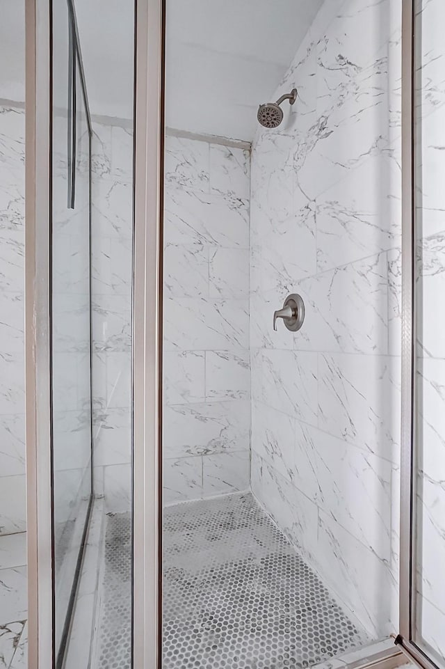 bathroom with a tile shower