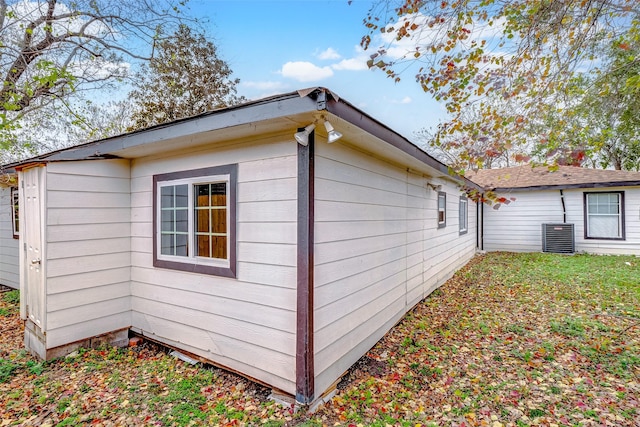 view of property exterior with central AC unit