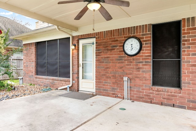 doorway to property featuring a patio and ceiling fan