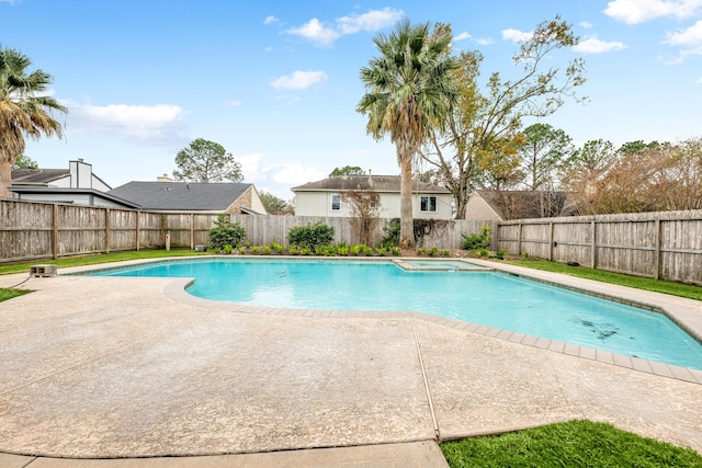 view of pool featuring an in ground hot tub and a patio area