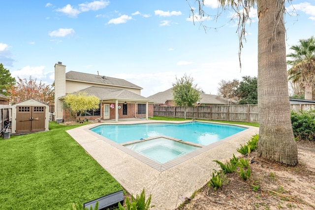 view of swimming pool with an in ground hot tub, a storage shed, and a lawn