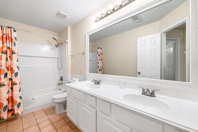 full bathroom with tile patterned floors, a textured ceiling, toilet, shower / tub combo with curtain, and vanity