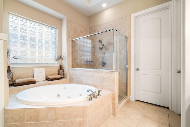 bathroom featuring tile patterned floors and separate shower and tub