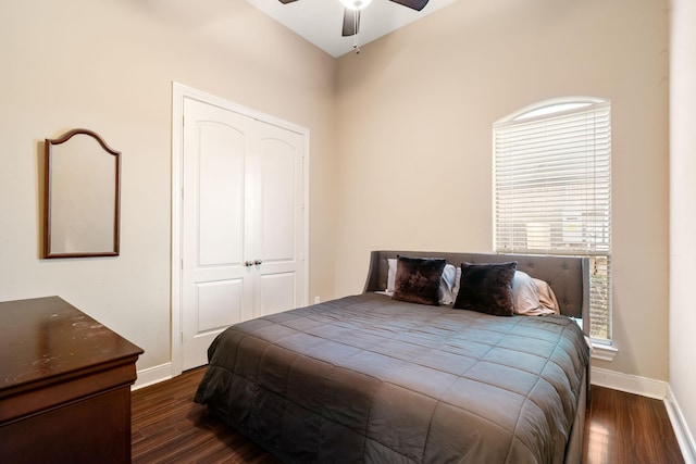 bedroom featuring dark hardwood / wood-style flooring, a closet, and ceiling fan