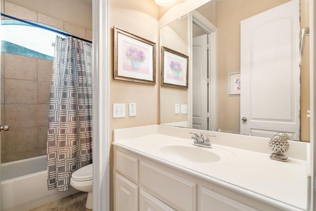 full bathroom featuring shower / bath combo, vanity, and toilet