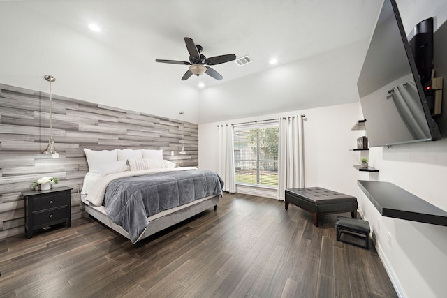 bedroom with vaulted ceiling, ceiling fan, and dark wood-type flooring