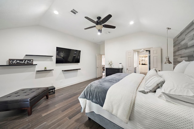 bedroom with vaulted ceiling, ceiling fan, wooden walls, and dark hardwood / wood-style floors