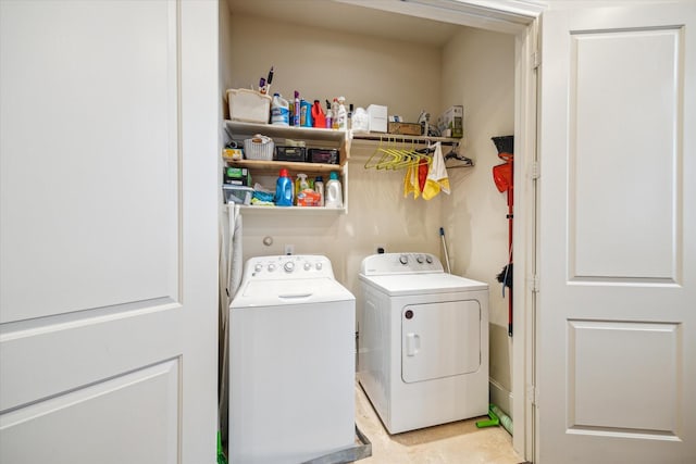 laundry room with washing machine and clothes dryer