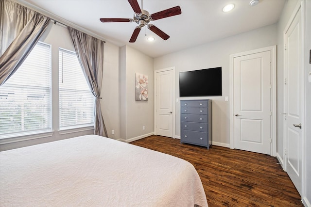 bedroom featuring ceiling fan and dark wood-type flooring