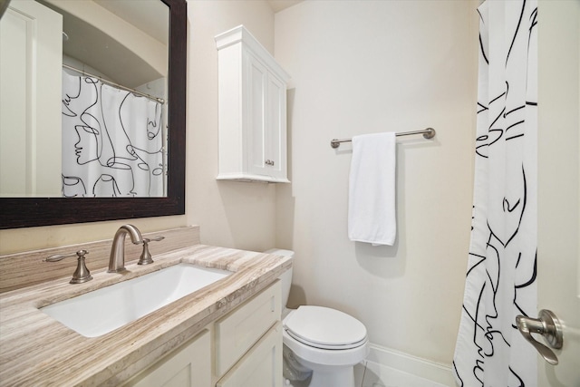 bathroom featuring curtained shower, toilet, and vanity