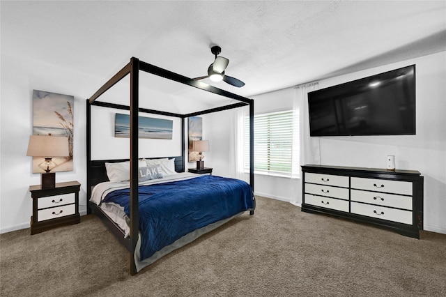 bedroom featuring ceiling fan, a textured ceiling, and carpet