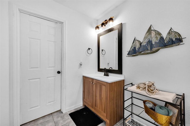 bathroom with tile patterned flooring and vanity