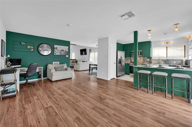 living room with light hardwood / wood-style flooring