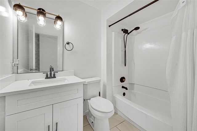 full bathroom with tile patterned flooring, vanity, toilet, and shower / bath combo with shower curtain