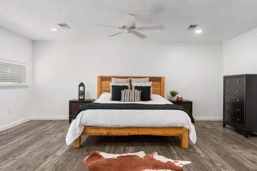 bedroom featuring dark hardwood / wood-style flooring and ceiling fan