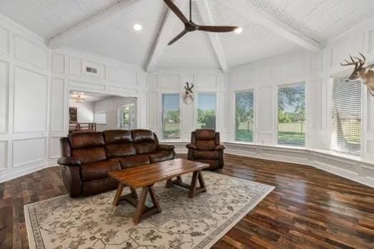 sunroom with lofted ceiling with beams, ceiling fan, and a healthy amount of sunlight