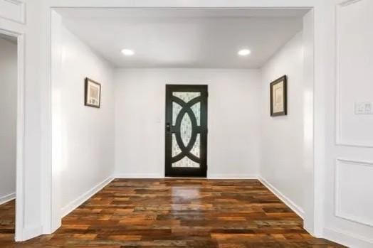 entrance foyer featuring dark hardwood / wood-style floors