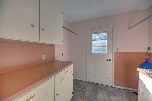 washroom featuring cabinets