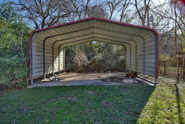 view of parking with a lawn and a carport