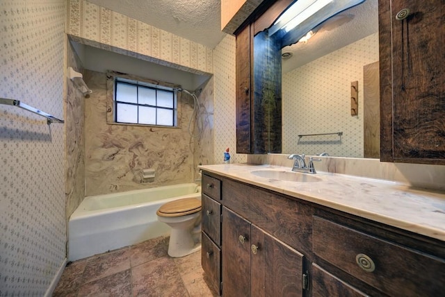 full bathroom featuring shower / bathing tub combination, vanity, toilet, and a textured ceiling