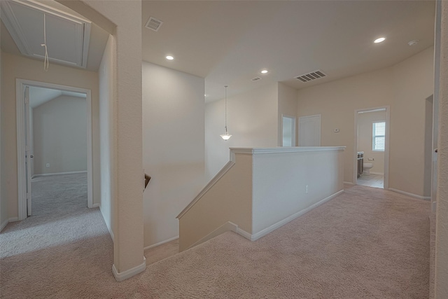 hallway with light carpet