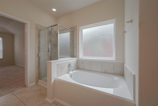 bathroom with tile patterned floors and separate shower and tub