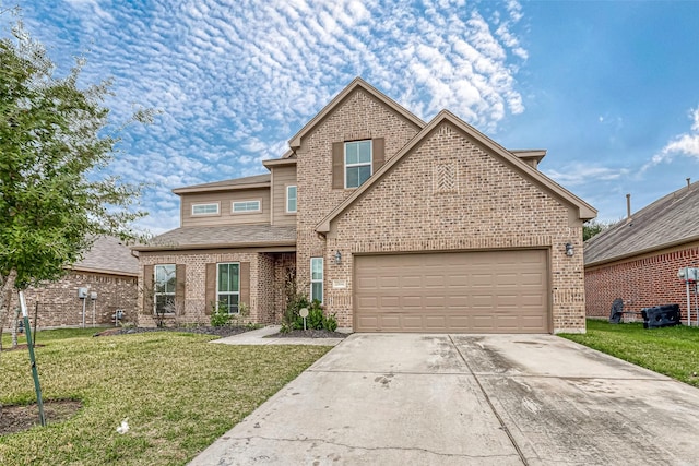 view of front property with a front yard and a garage