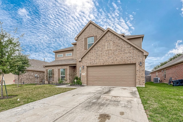 front facade with a front lawn, a garage, and central AC