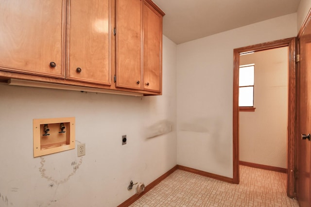 clothes washing area featuring cabinets, gas dryer hookup, washer hookup, and hookup for an electric dryer