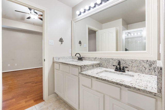 bathroom featuring vanity, tile patterned flooring, and ceiling fan