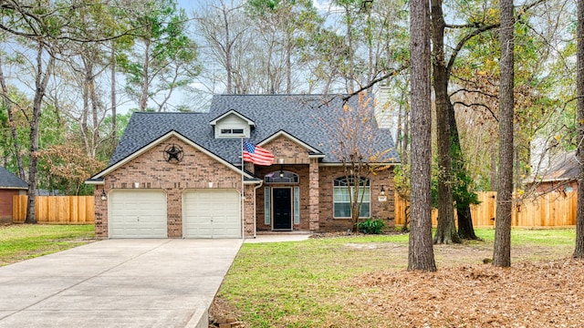 front facade featuring a front yard and a garage