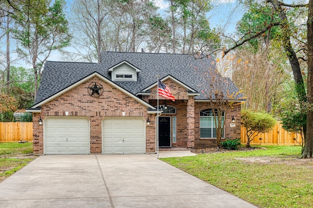 view of front of house with a garage and a front lawn