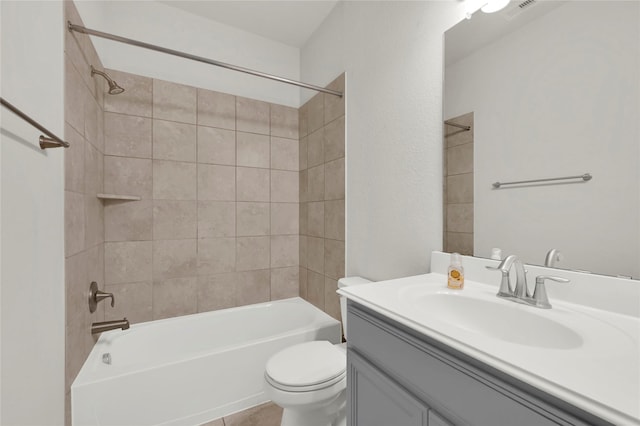 full bathroom with tile patterned floors, vanity, toilet, and tiled shower / bath