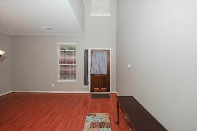 entryway with hardwood / wood-style floors