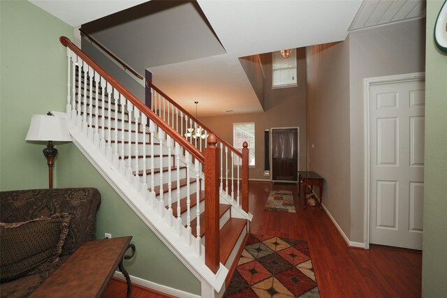 foyer featuring a chandelier and hardwood / wood-style flooring