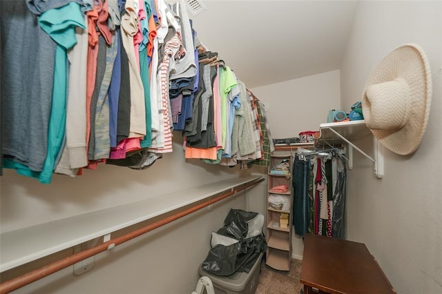 walk in closet featuring carpet floors