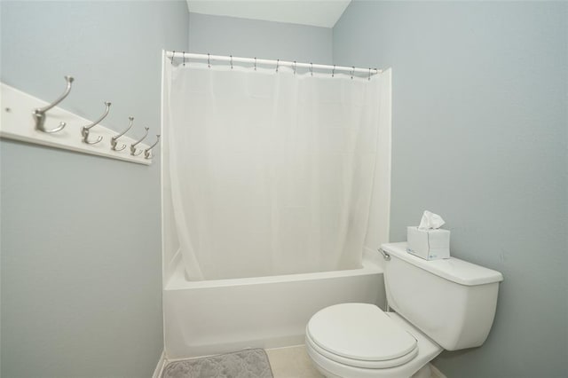 bathroom featuring shower / bath combo with shower curtain and toilet