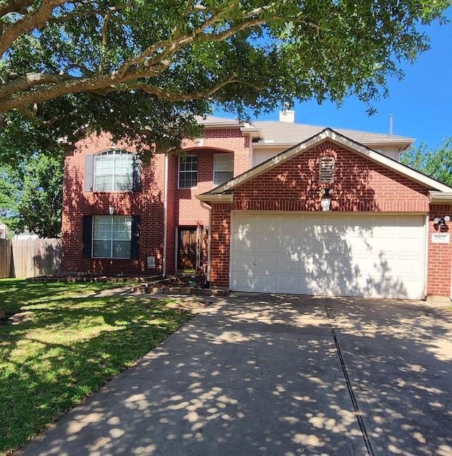 front facade with a garage and a front lawn