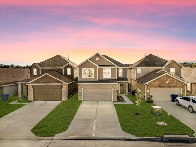 view of front facade featuring a yard and a garage